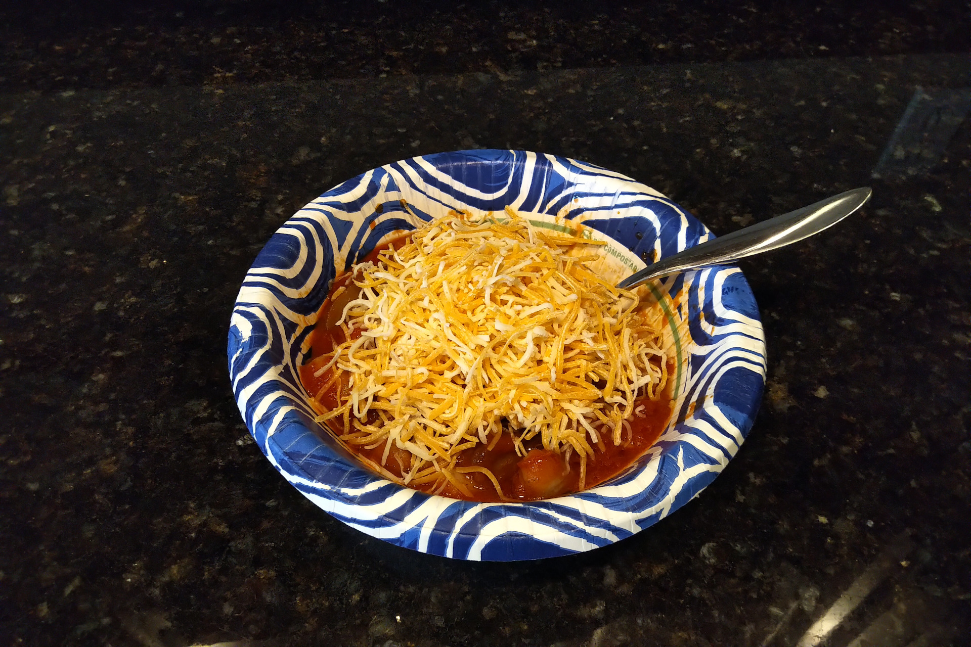 Picture of a bowl of gluten free gnocchi with sauce and cheese