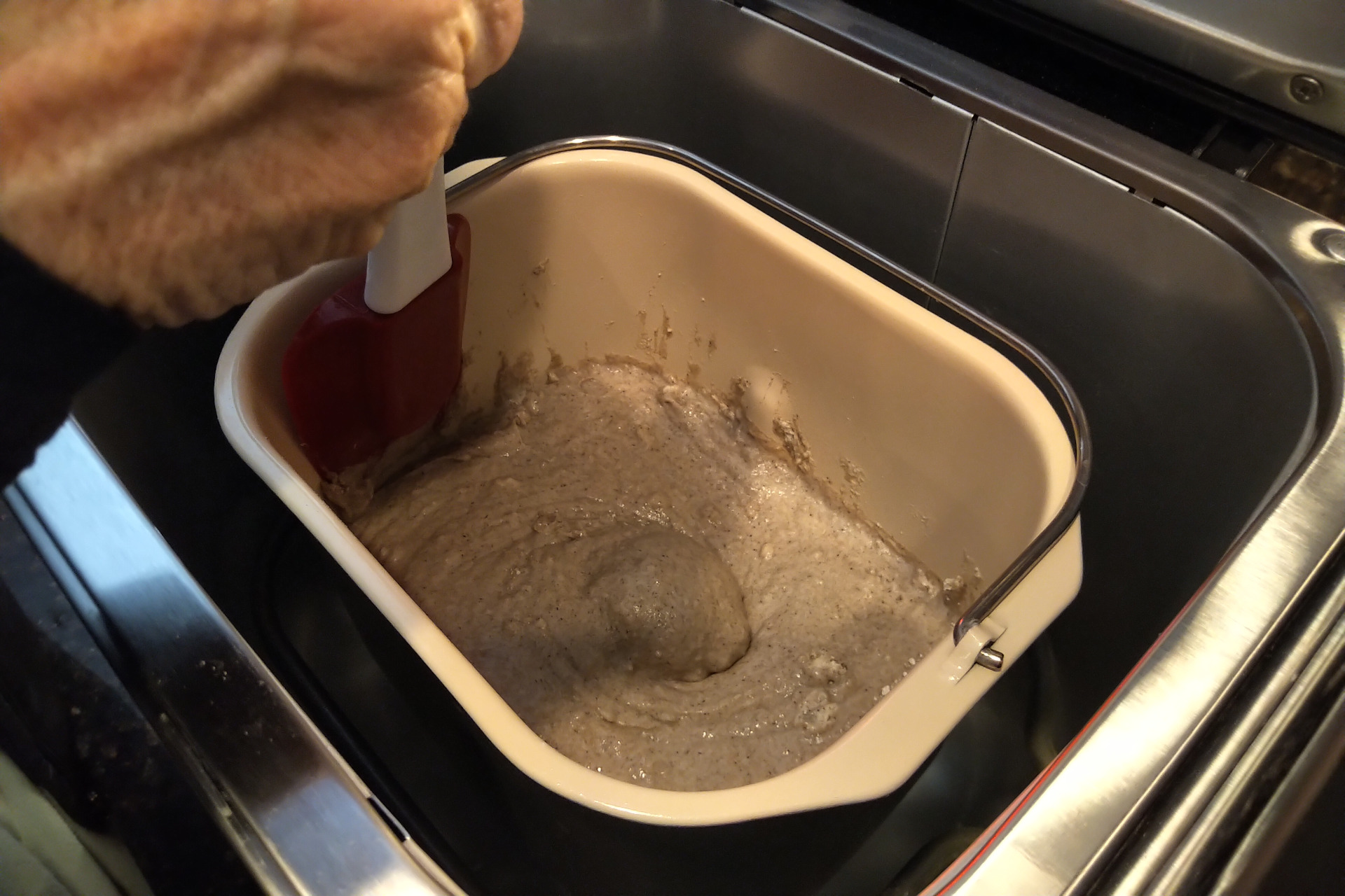 Pushing dry ingredients down with a spatula