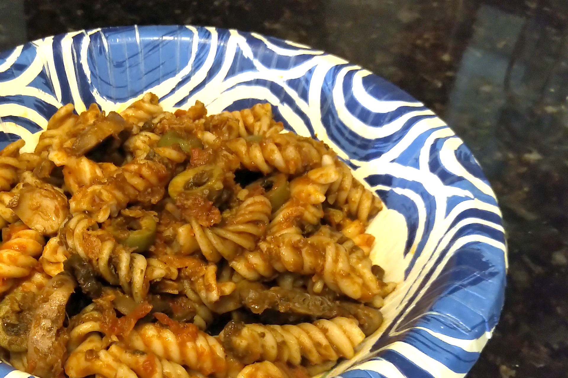 Gluten free fusilli pasta with duckweed, mushrooms, and olives
