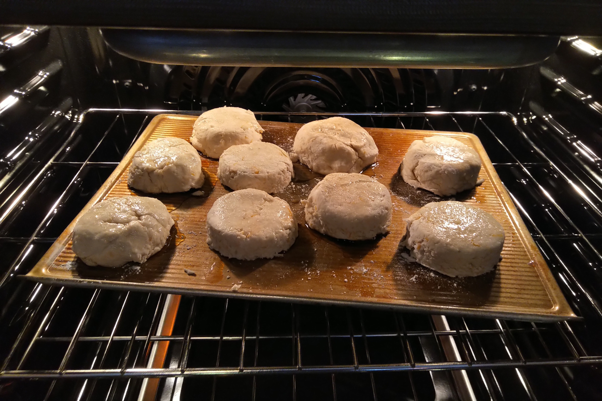 Biscuits on baking sheet in oven