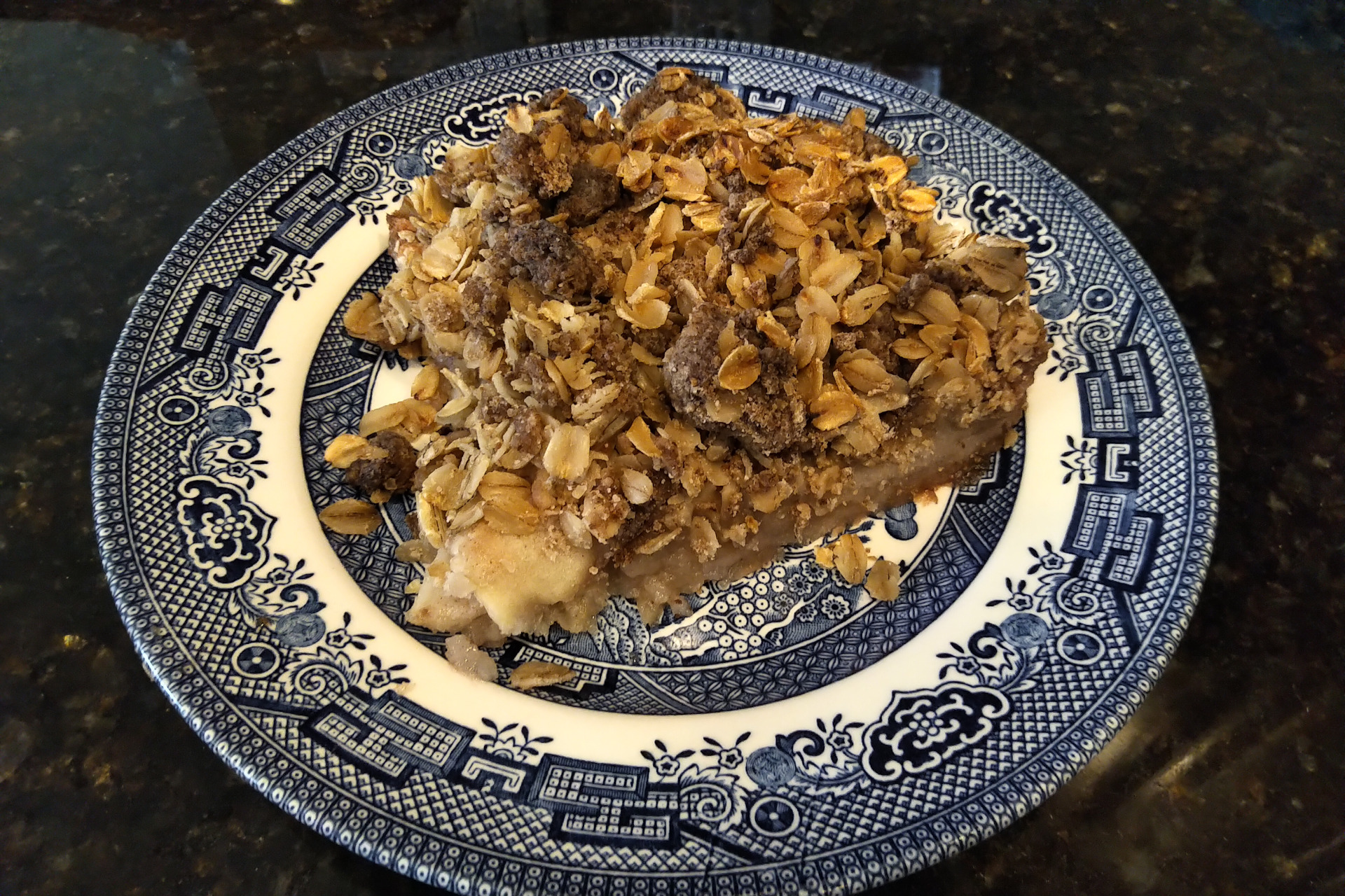 Slice of apple crisp on a plate