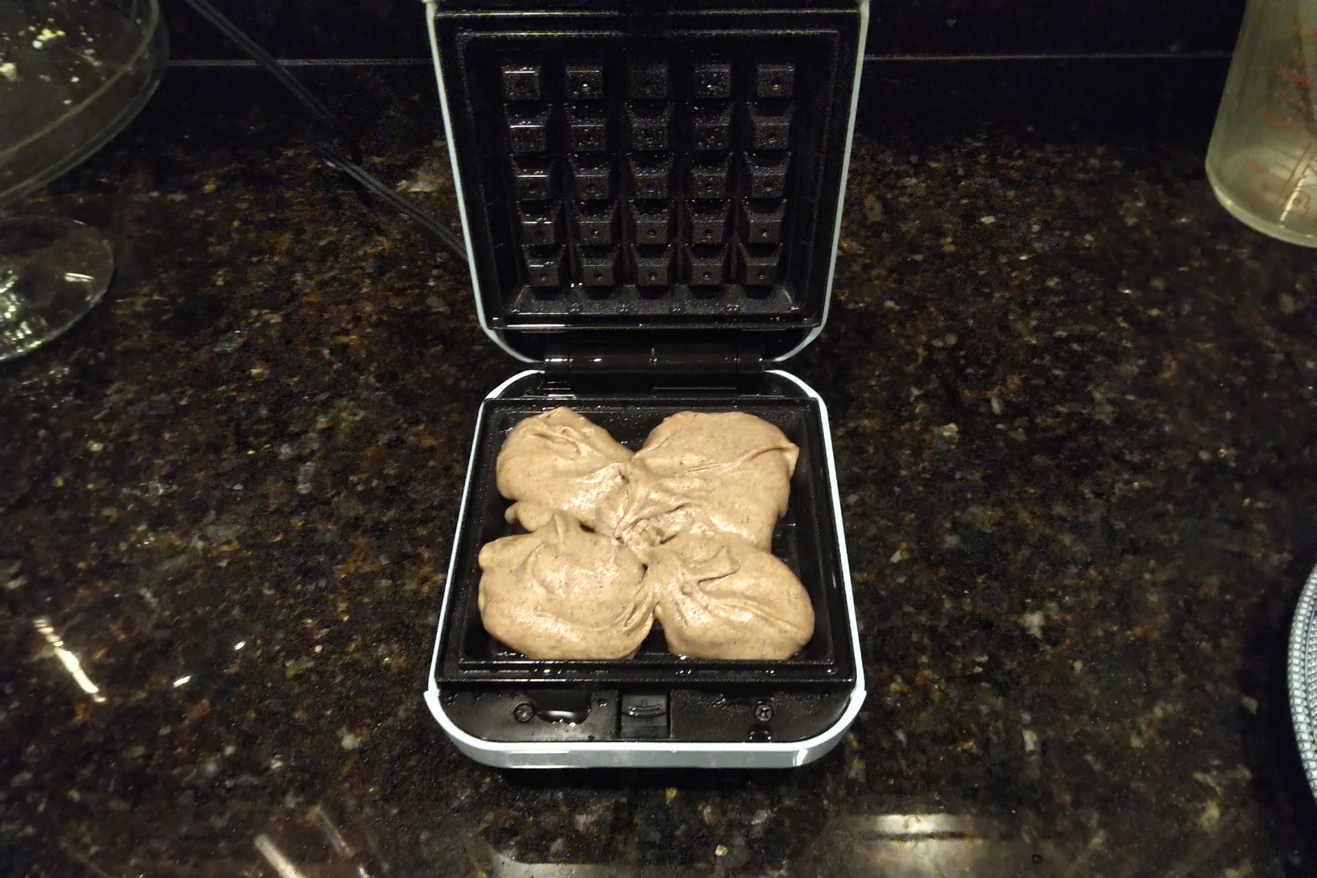 Waffle batter in a waffle iron